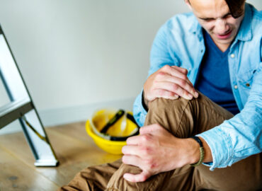 A personal injury lawyer reviewing a client's accident claim and the compensation they can get for their losses.